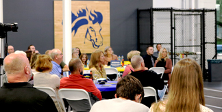 Athletic hall with people listening