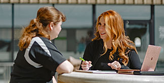 A woman talking to her manager