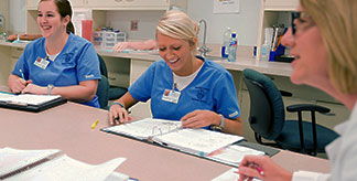 Hospital staff talking around a table