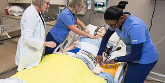 Nursing students practicing a class activity.