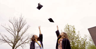 graduates throwing caps