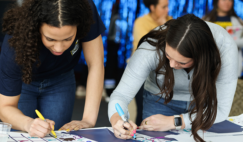 Students working on a poster