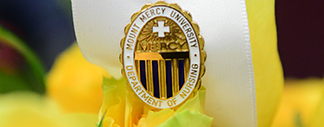 A nursing student receiving their pin