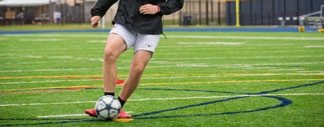 soccer ball being pushed around by kids