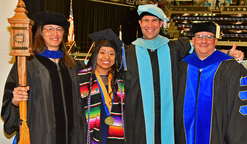 Alma posing with university professors and officials after receiving the Catherine McAuley award