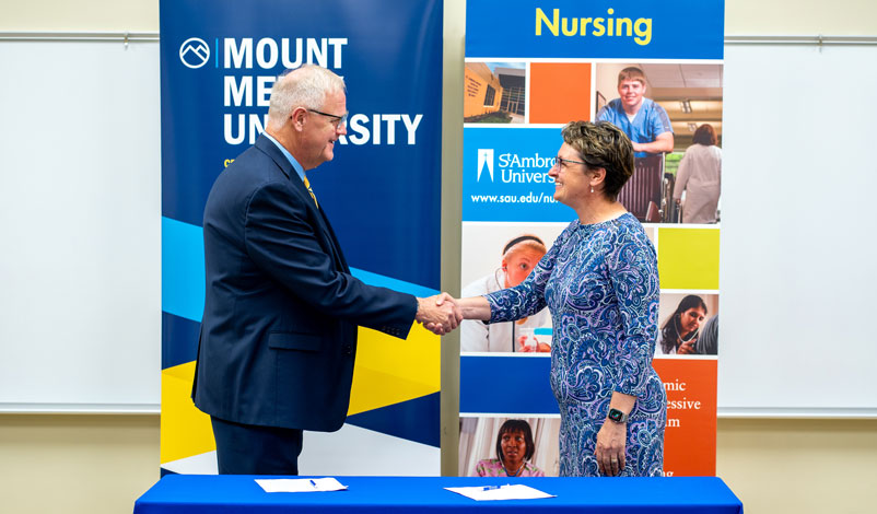 mount mercy st ambrose articulation agreement handshake