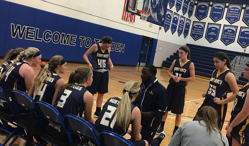 Bedford coaching the Women's Basketball Team