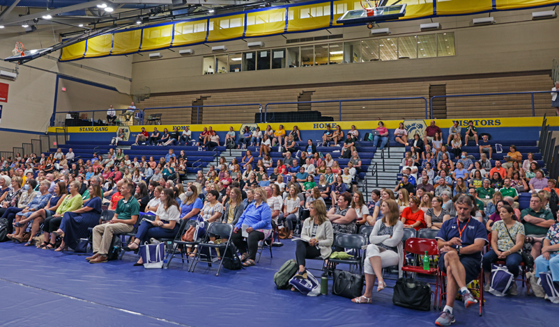 Educators listening to a speaker