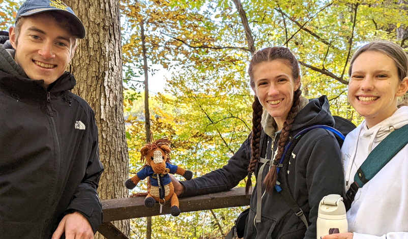 Honor students (Andrew Lorig, Katie Garner, and Emily Buckingham) at Lacey-Keosaqua State Park during the Fall 2022 Honors trip.