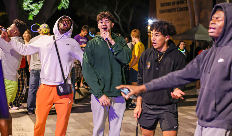 Mount Mercy students singing karaoke