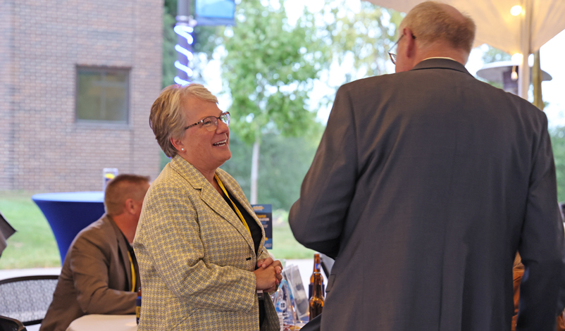 LeAnn Ridgeway speaking with the Mount Mercy University President