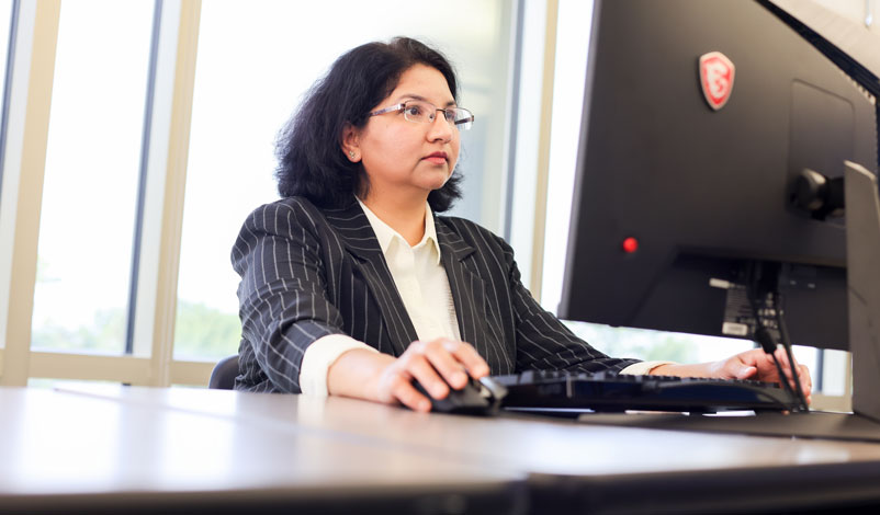 ritu shandilya on a computer in the crst data intelligence lab