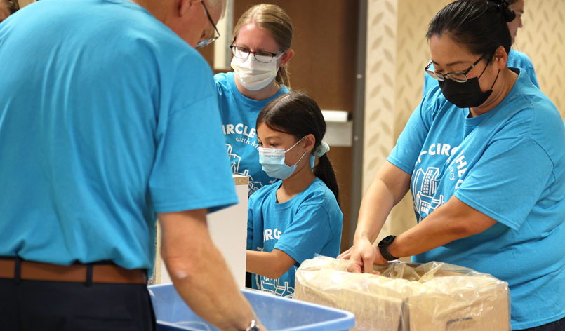 Volunteers working on food packages.