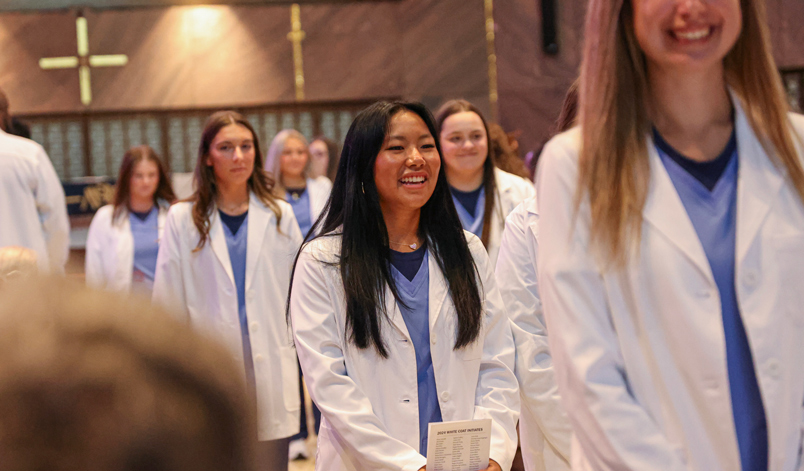 nursing student accepts white nursing coat