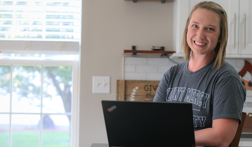 rebecca moore on the computer smiling