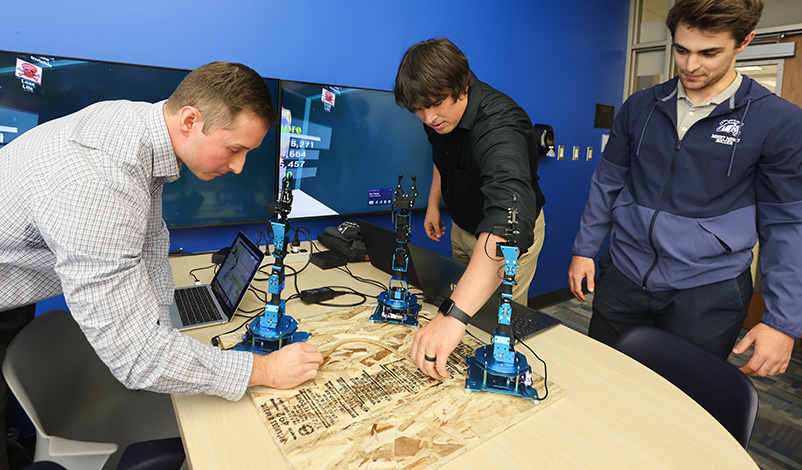 MMU students using robotics equipment