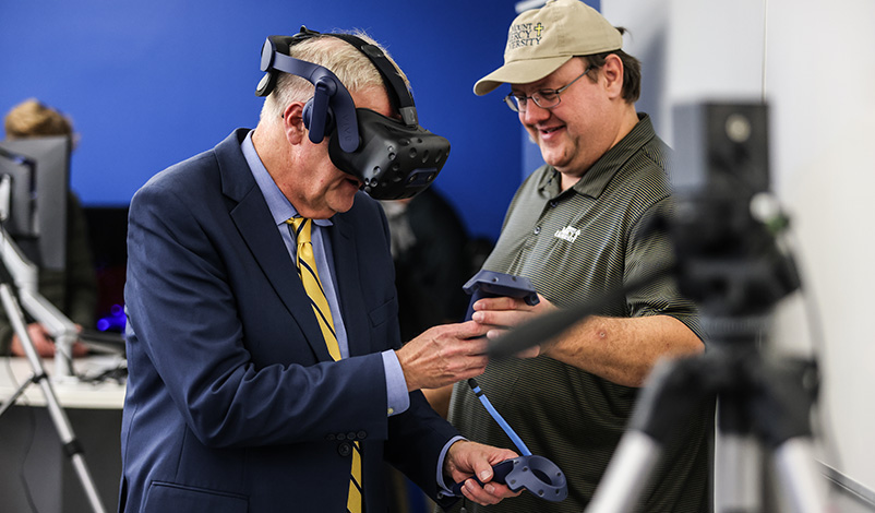 a man with virtual reality equipment