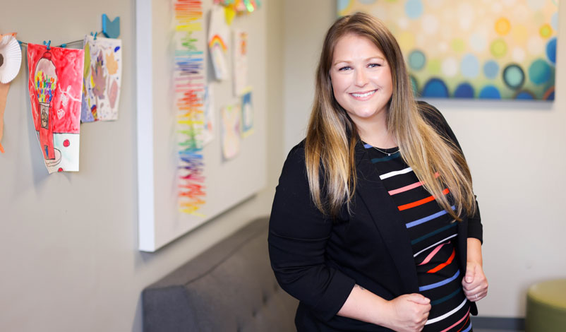 Laura Martin, standing in the lobby at Kids First Law Center