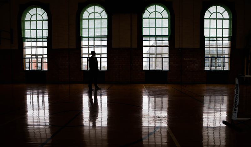 Nick Peitz, standing in front of the windows of the Mount Pleasant correctional facility