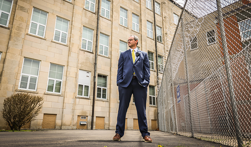 Nick Peitz, standing in front of the Mount Pleasant Correctional Facility building