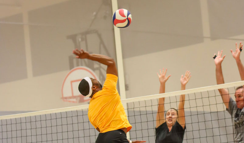 Damitri playing volleyball