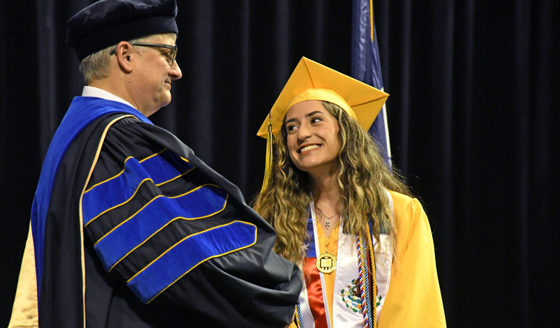 Tiara on stage being presented with the McAuley award