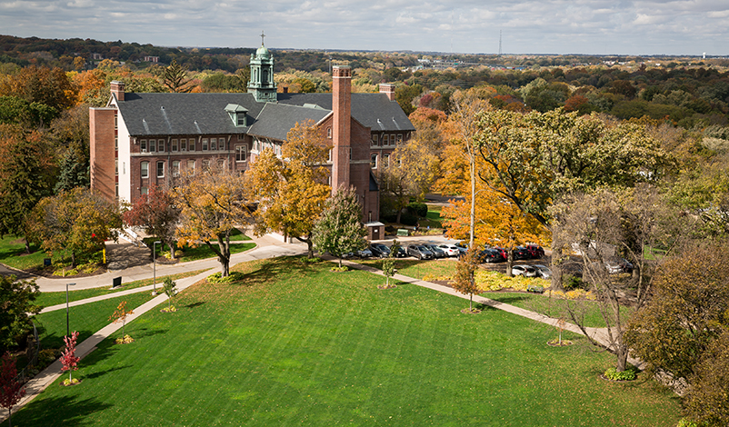 A photo of Warde Hall overlooking the main campus in summer