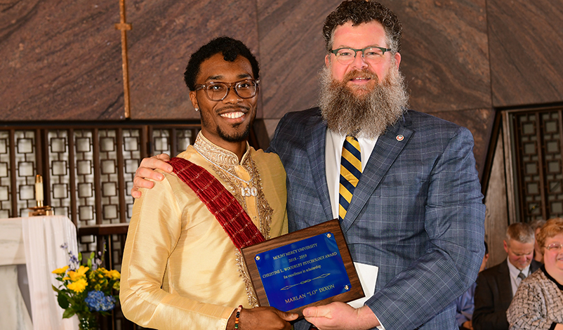 Marlon LO Dixon and Dennis Dew, associate professor of psychology, at Honors Convocation.