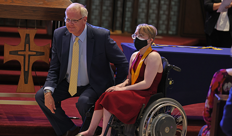 Gwen and President Olson posing for a photo