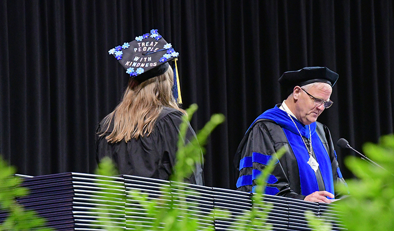 Emma Lantz on stage, accepting her award