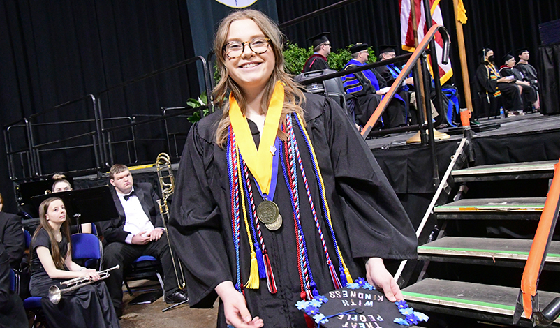 Emma Lantz, smiling with her award