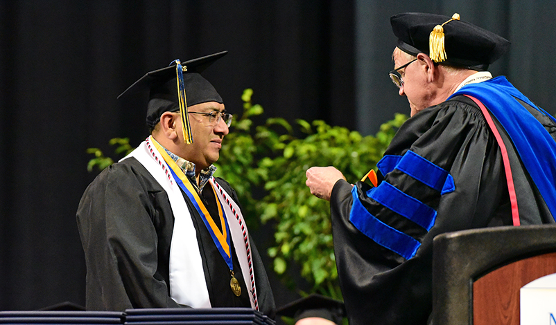 Marco Delgado receiving his award