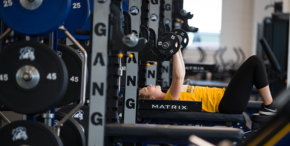 A student lifting weights