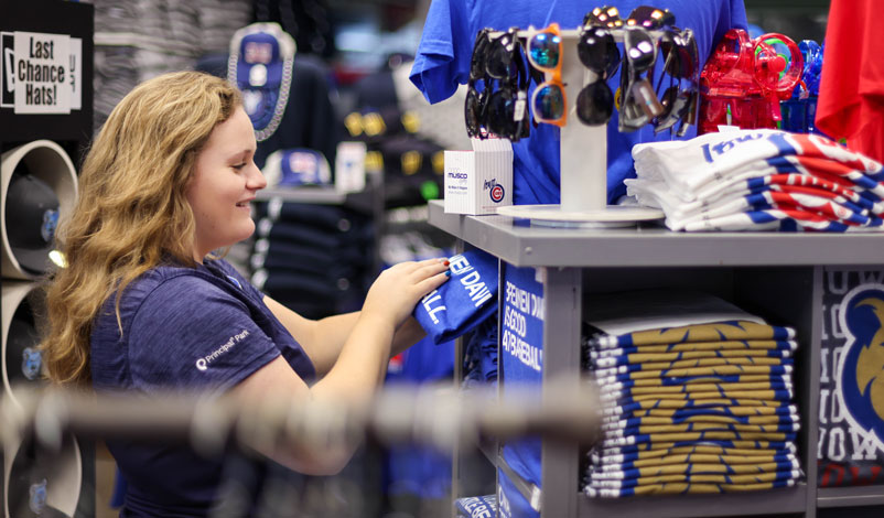 Katelyn Kral, sorting merchandise for the Iowa Cubs