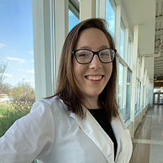 Student Monica Steffen in her white lab coat