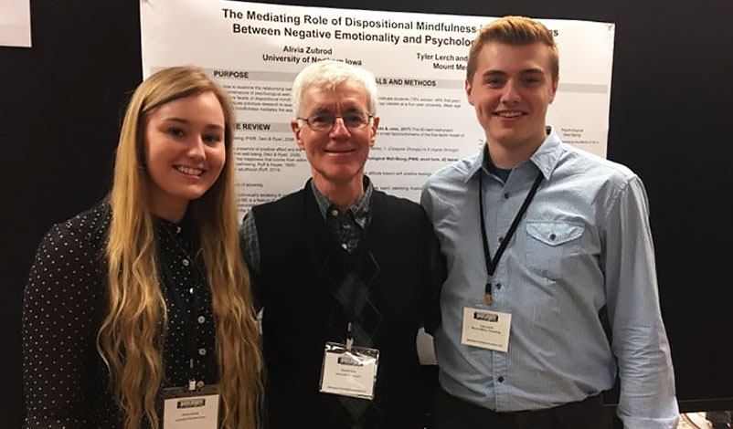 Alivia Zubrod (left), Dr. Ron Feldt (middle), and Tyler Lerch (right) at a conference.