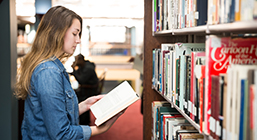 Mount Mercy University student in busse library